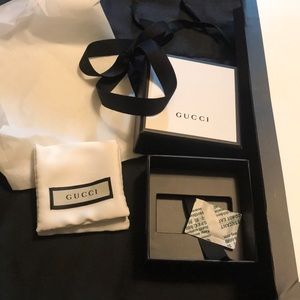 Gucci gift bag, box, and necklace box.